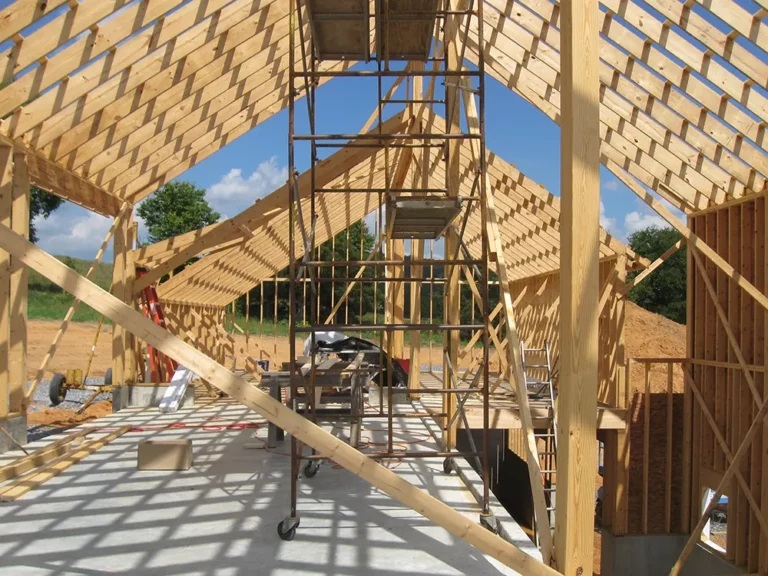 view from inside the wooden frame of the future tasting room building