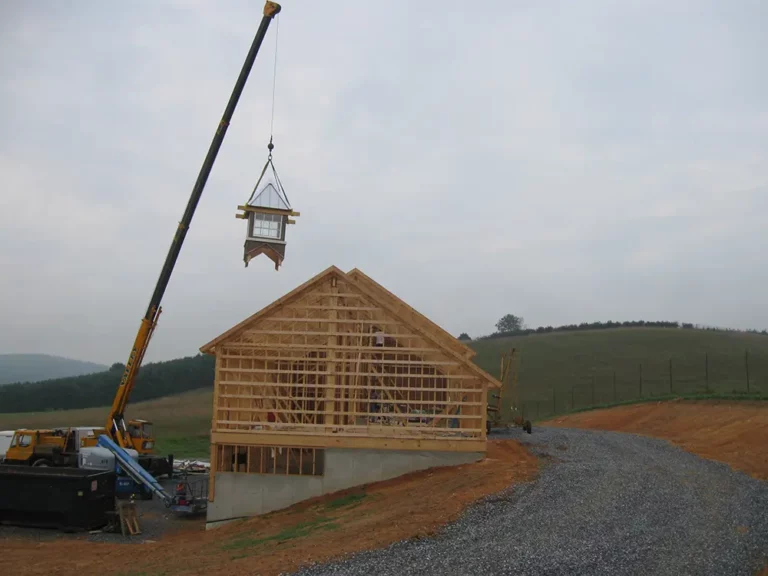 crane lifting cupola onto the roof