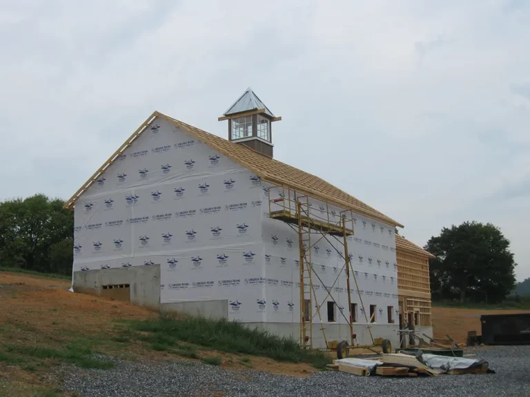 outside view of tasting room building wrapped in weatherproofing